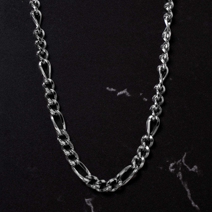 Our 5MM Silver Figaro Chain features our premium silver figaro chain and signature polished silver plate, engraved with RG&B.